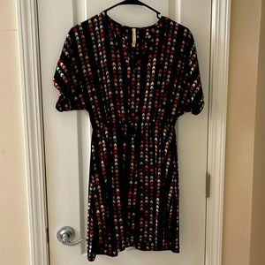 Black dress with chevron pattern.